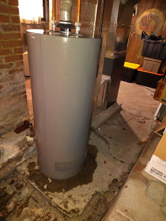 utility room featuring water heater