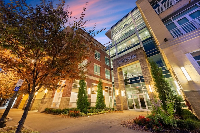 view of outdoor building at dusk