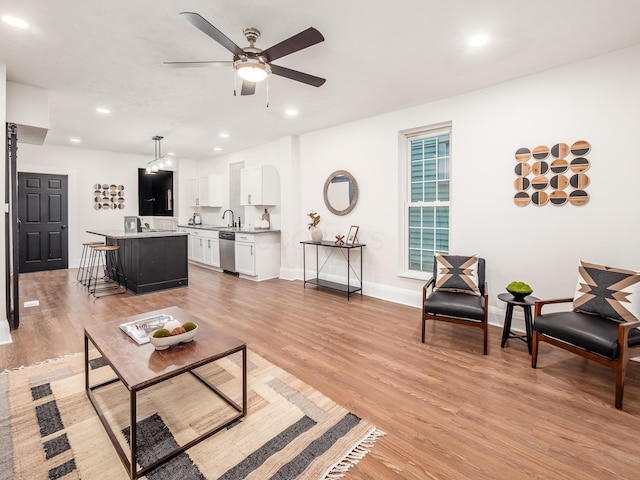 1327 Atcheson St, Columbus, OH 43203 - living area with light wood-style flooring, a ceiling fan, and recessed lighting