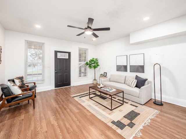 1327 Atcheson St, Columbus, OH 43203 - living area with ceiling fan, light wood finished floors, and recessed lighting
