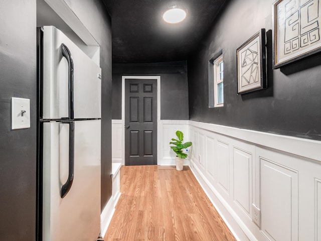 1327 Atcheson St, Columbus, OH 43203 - hallway with light wood-style floors and wainscoting