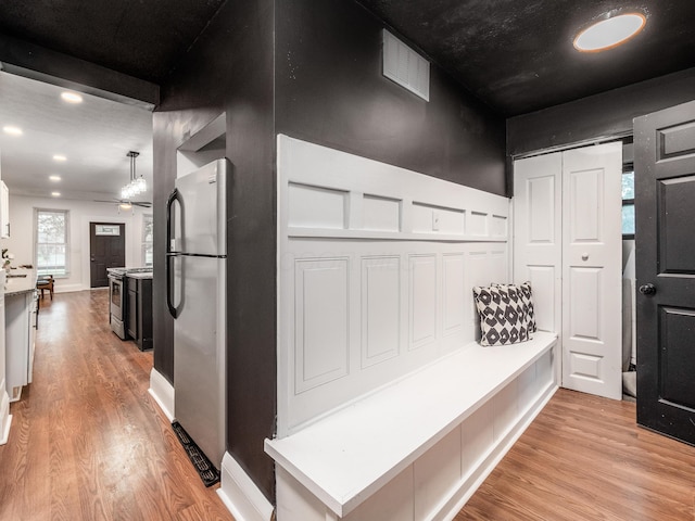 1327 Atcheson St, Columbus, OH 43203 - mudroom featuring light wood-type flooring and ceiling fan