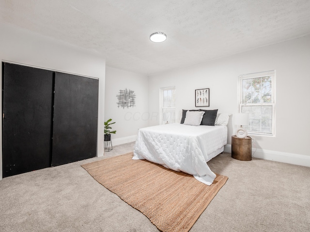 1327 Atcheson St, Columbus, OH 43203 - carpeted bedroom with baseboards and a closet