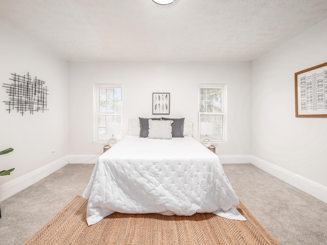1327 Atcheson St, Columbus, OH 43203 - bedroom with light colored carpet and multiple windows