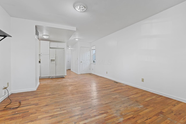 spare room with light wood-type flooring