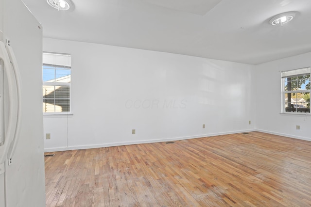 unfurnished room featuring light wood-type flooring