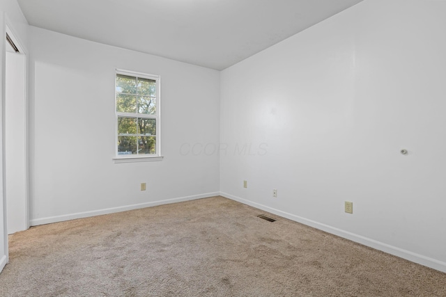 spare room with carpet flooring