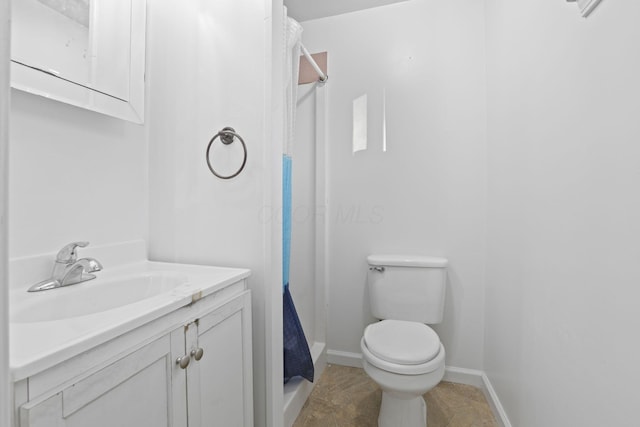 bathroom with curtained shower, tile patterned flooring, vanity, and toilet