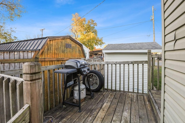 wooden deck with a storage shed