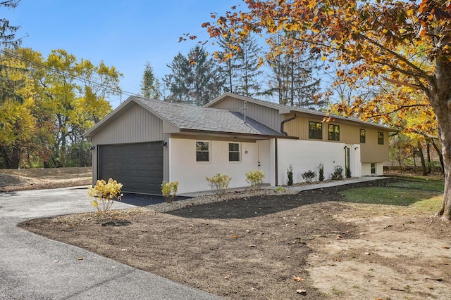 view of side of home with a garage