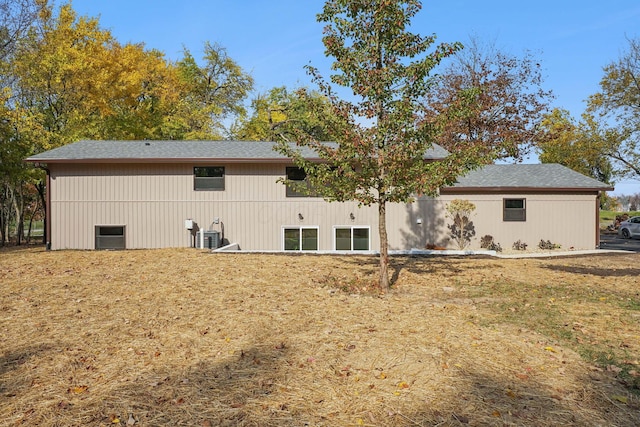 back of property featuring central air condition unit