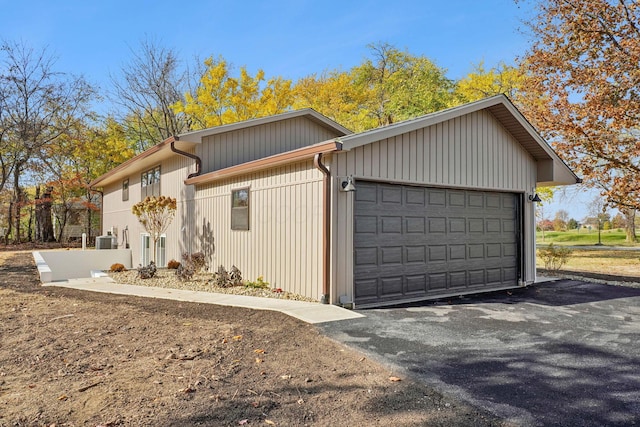 exterior space featuring a garage and central AC unit