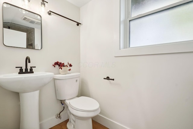 bathroom with toilet and sink