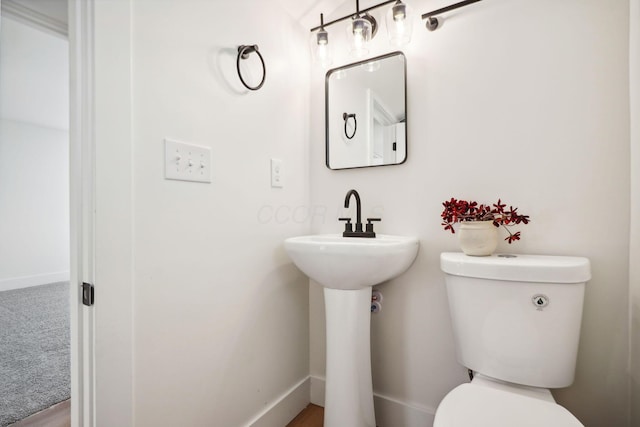 bathroom with toilet and sink