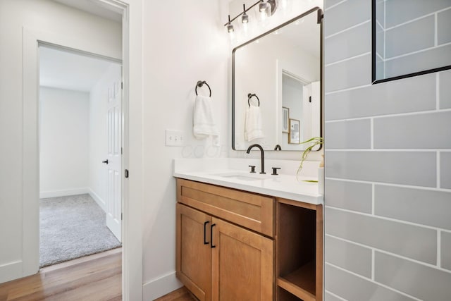 bathroom with vanity and hardwood / wood-style flooring