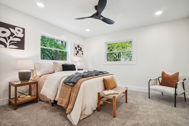 bedroom with ceiling fan and carpet floors