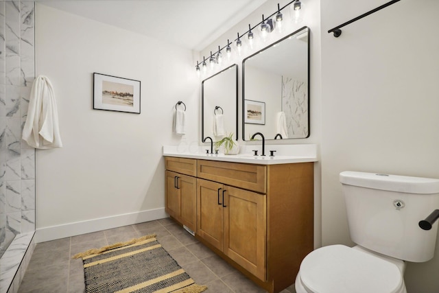 bathroom with tile patterned floors, vanity, and toilet