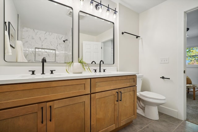 bathroom with a shower, tile patterned flooring, vanity, and toilet