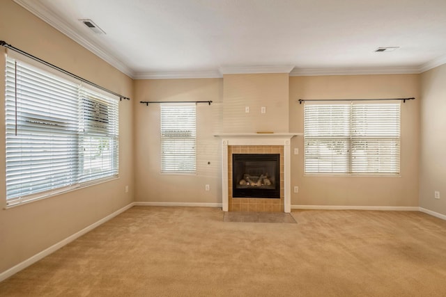 unfurnished living room with a fireplace, light colored carpet, and crown molding