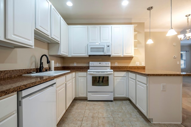 kitchen featuring white cabinets, sink, white appliances, and kitchen peninsula