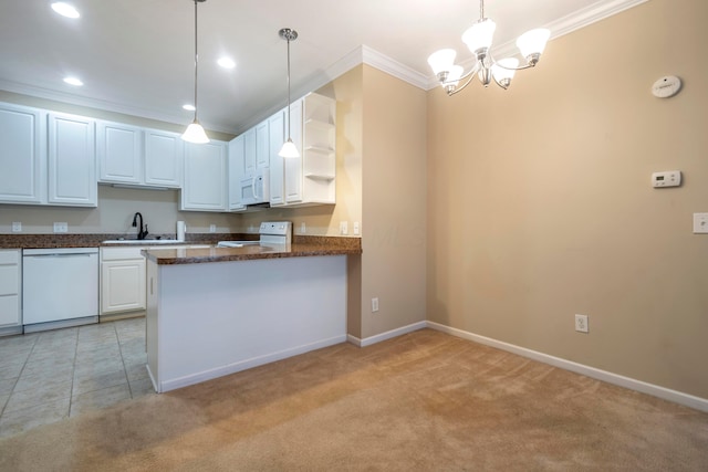 kitchen featuring white appliances, light colored carpet, sink, pendant lighting, and white cabinets