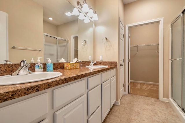 bathroom with vanity and walk in shower