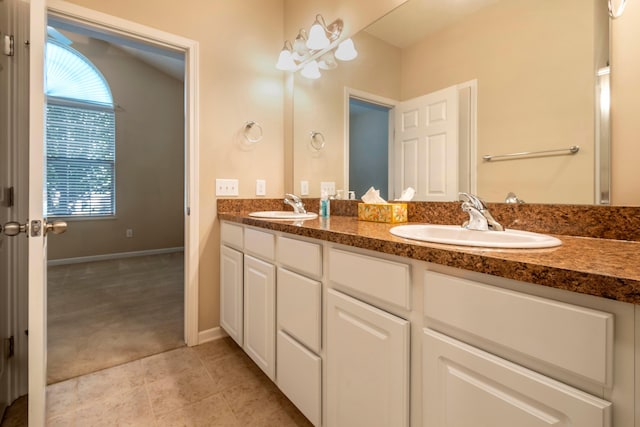 bathroom featuring tile patterned flooring and vanity