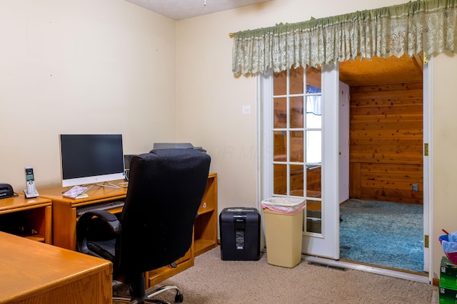 office with wooden walls and carpet floors