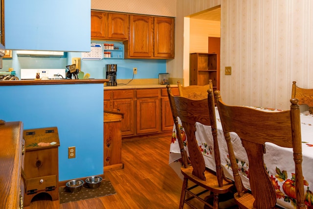 kitchen with dark hardwood / wood-style floors and extractor fan