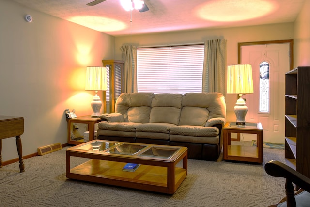 living room with carpet, plenty of natural light, and ceiling fan