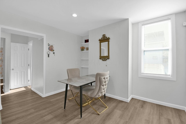 dining area with light hardwood / wood-style floors