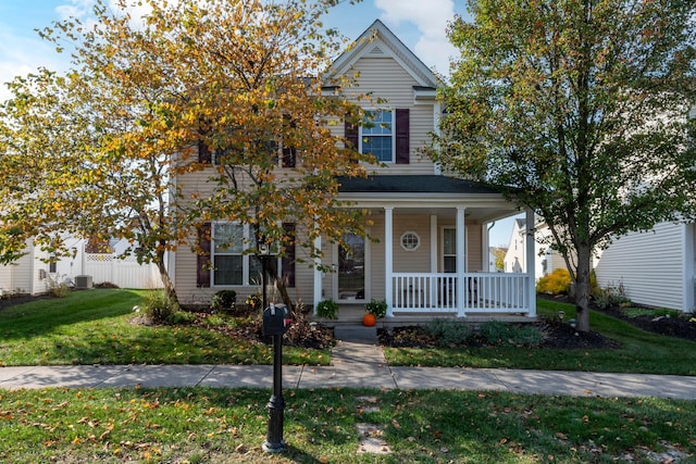 view of front of home with a porch and a front lawn