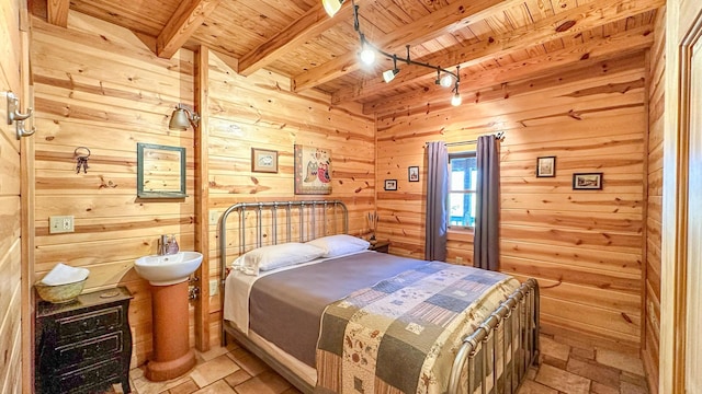 bedroom with beamed ceiling, wooden ceiling, and wood walls