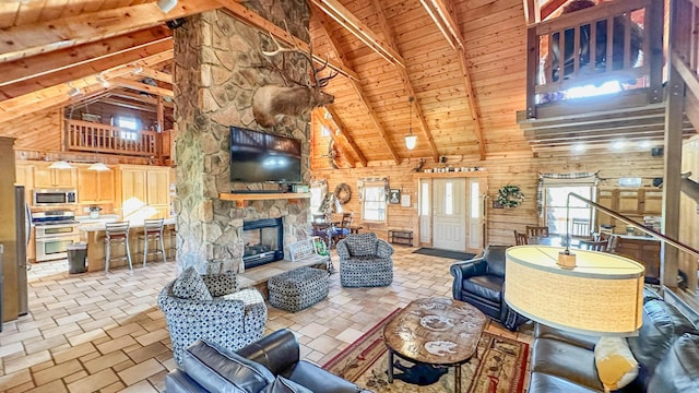 living room with beamed ceiling, high vaulted ceiling, wooden ceiling, and wooden walls