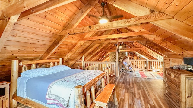 bedroom with hardwood / wood-style flooring, vaulted ceiling with beams, and wooden ceiling