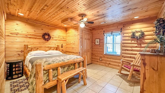 bedroom featuring rustic walls, ceiling fan, light tile patterned floors, and wood ceiling