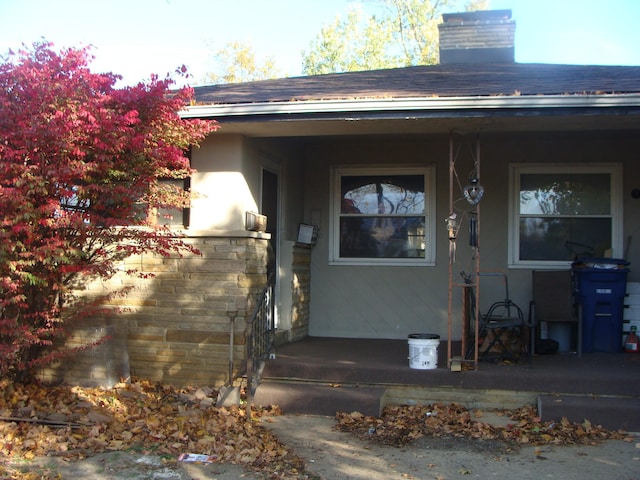 doorway to property featuring covered porch