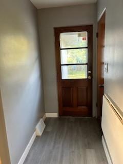 doorway to outside featuring hardwood / wood-style flooring