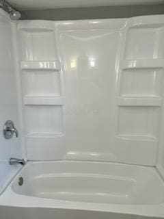 bathroom with shower / washtub combination