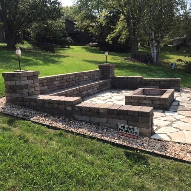 surrounding community featuring a patio area, a yard, and an outdoor fire pit