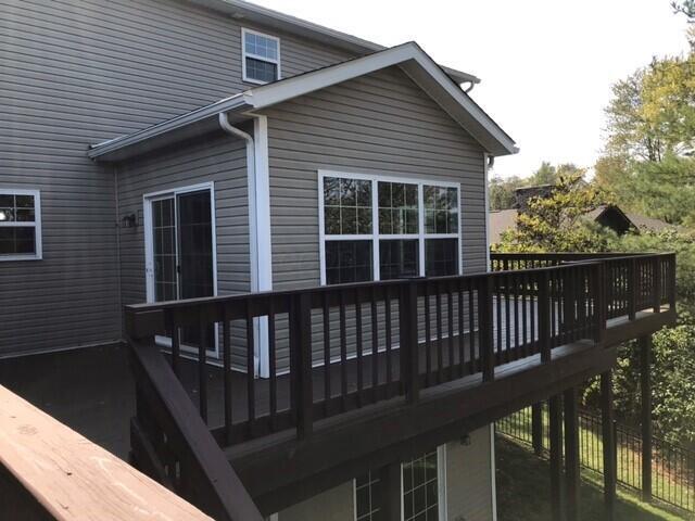 rear view of property with a wooden deck