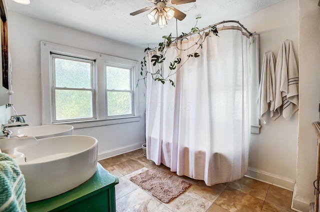 bathroom featuring vanity and ceiling fan