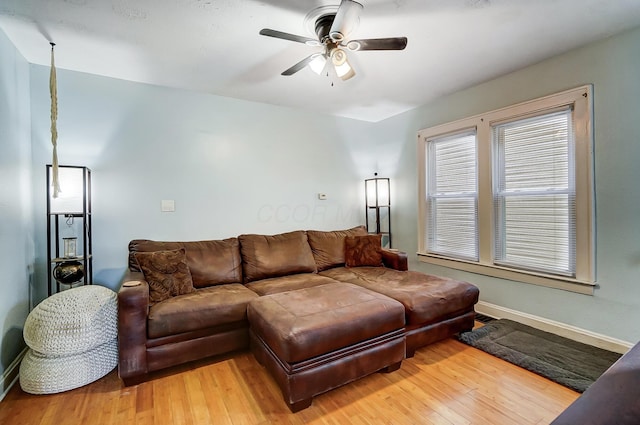 living room with hardwood / wood-style flooring and ceiling fan