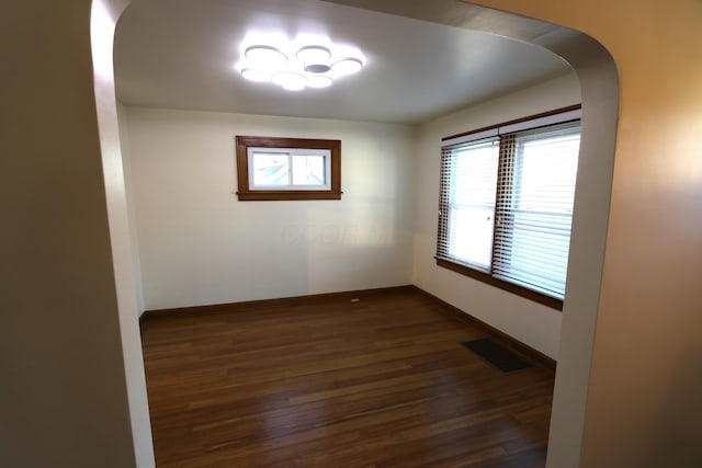 empty room featuring dark hardwood / wood-style floors