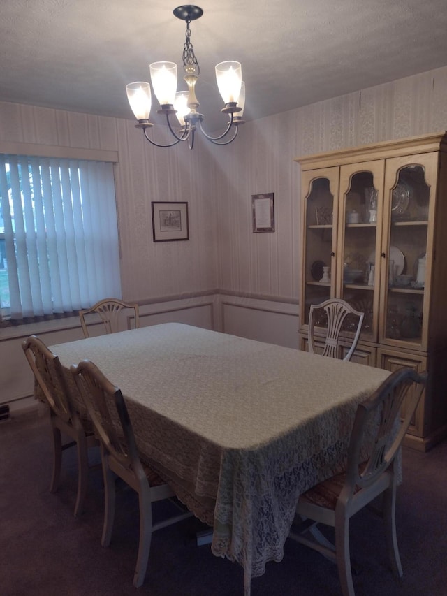 dining space featuring an inviting chandelier