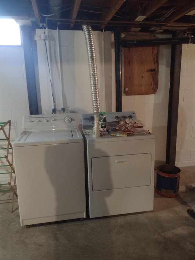 washroom with independent washer and dryer