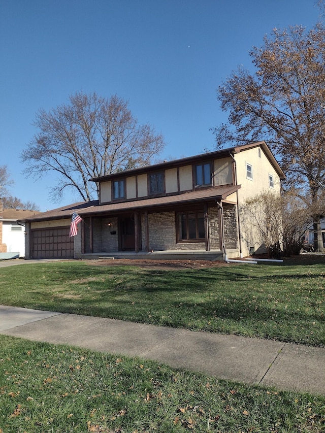 view of front facade with a front yard and a garage