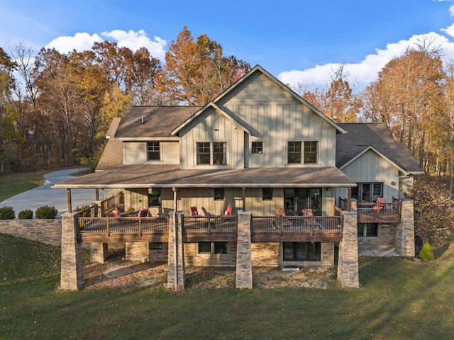 back of house with a lawn