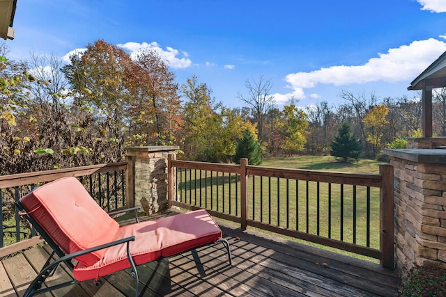 wooden terrace with a lawn