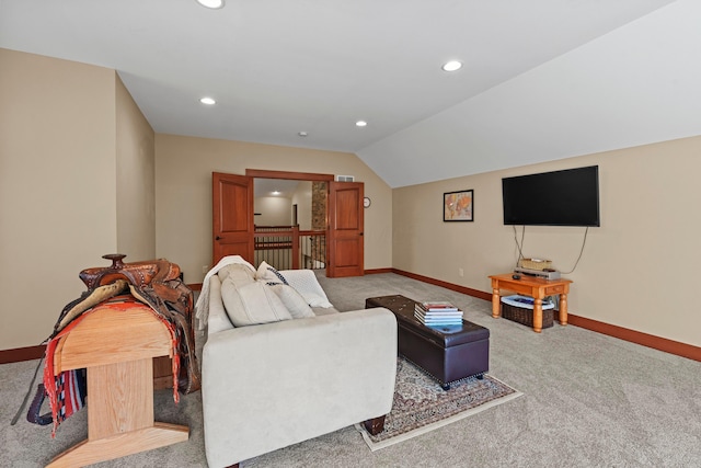 carpeted living room with lofted ceiling